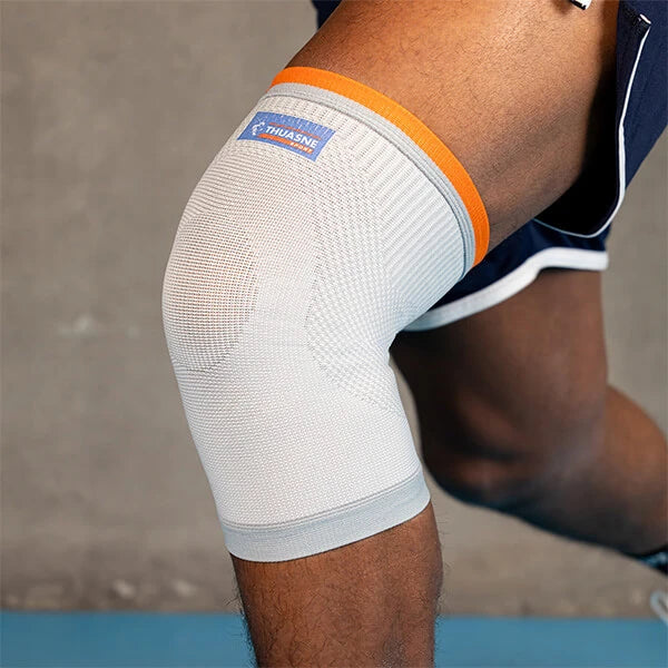 Genouillère de maintien compressive